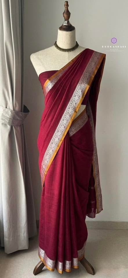 Wine saree with a gold border
