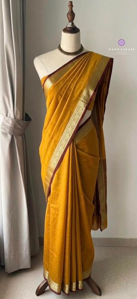 Gold-toned saree on a mannequin