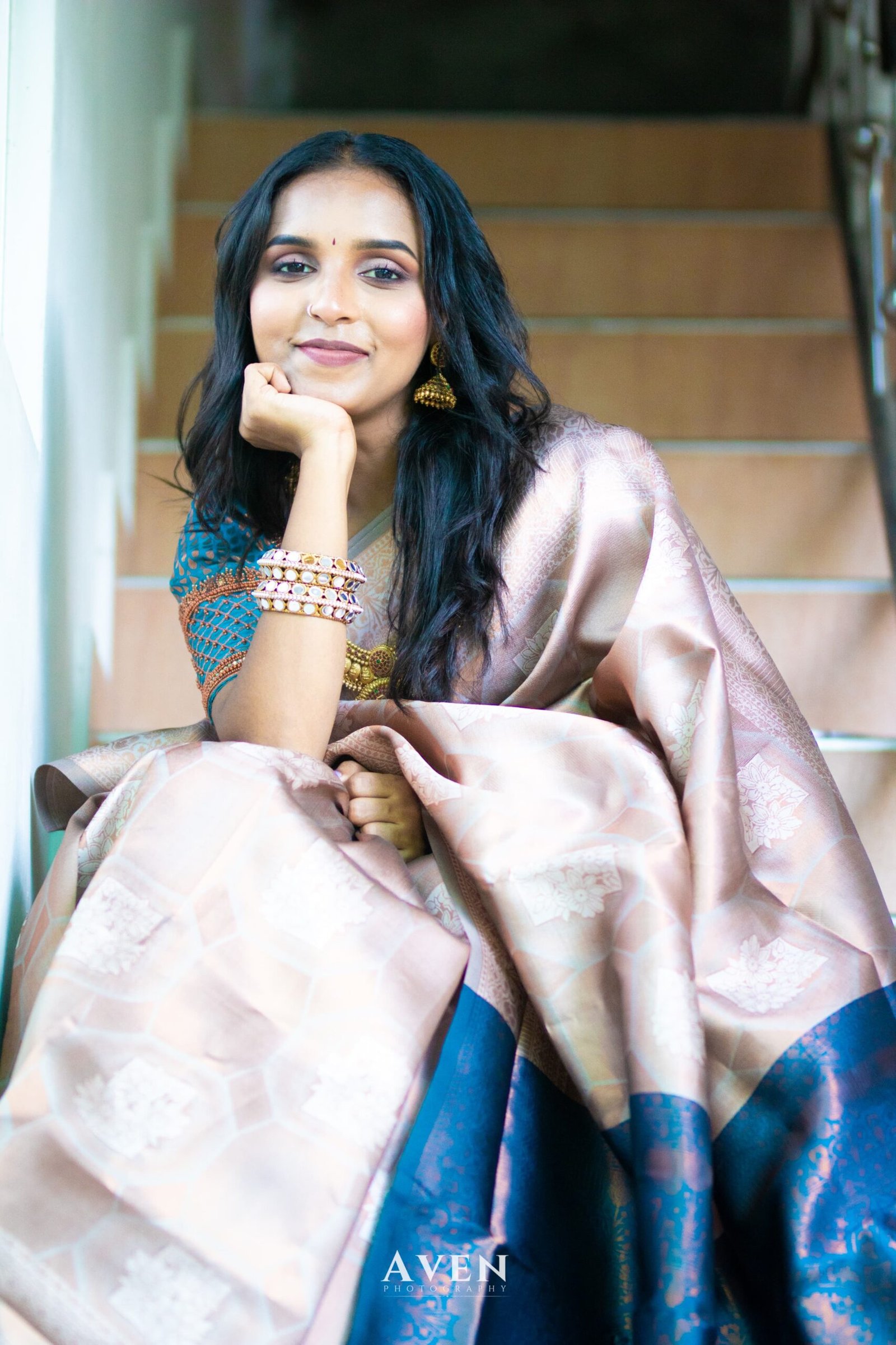 Soft rose saree with a contrasting turquoise blouse